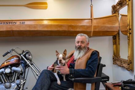 image of Mr.Mullen and his dog inside his Hair salon