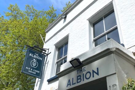 Entrance to pub with sign of Albion