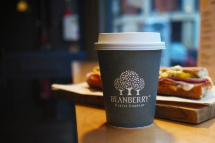 beanberry coffee cup and pastries in background