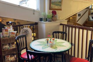 image of tables and chairs inside Caffe Antico o Old London Road Kingston