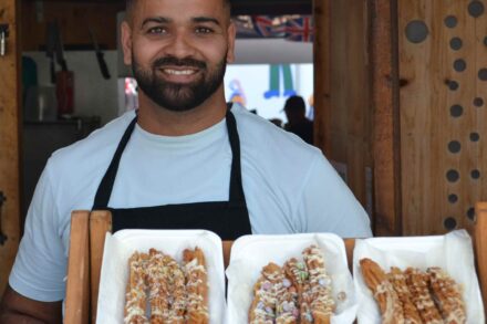 Image of the owner of Senor Churros with Churros