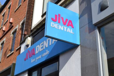 Image of Jiva dental signage outside the clinic
