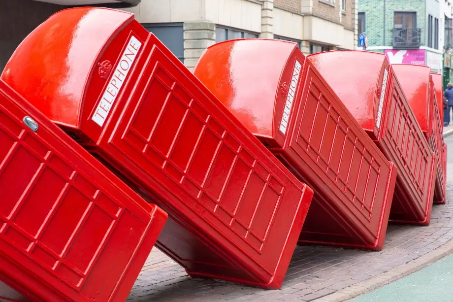 Red telephone boxes toppled onto each other