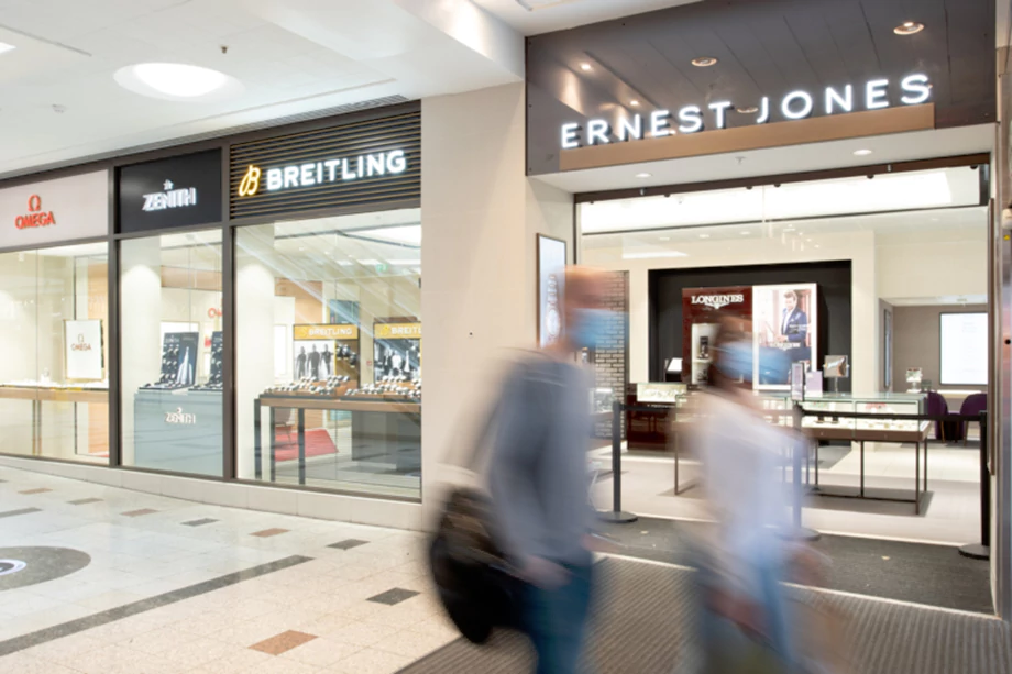 Store front with company logo and display cases.