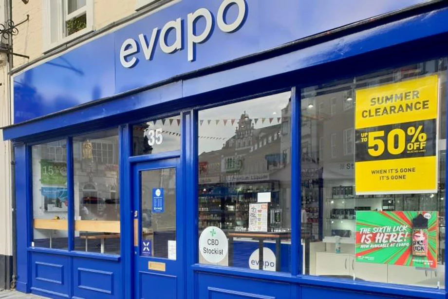 Shop front with company logo and display cabinets.