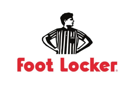 Shop front with brand logo and shoes in the window