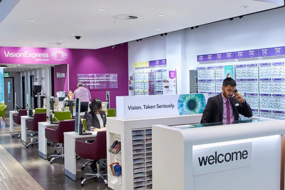 Store layout with a man on the phone behind a counter