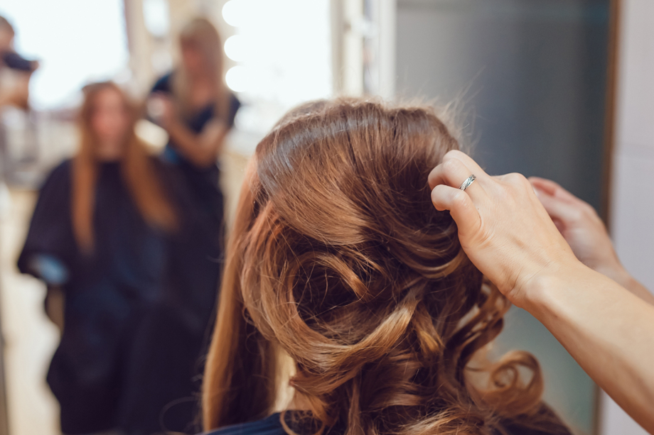 Woman having hair styled in a salon
